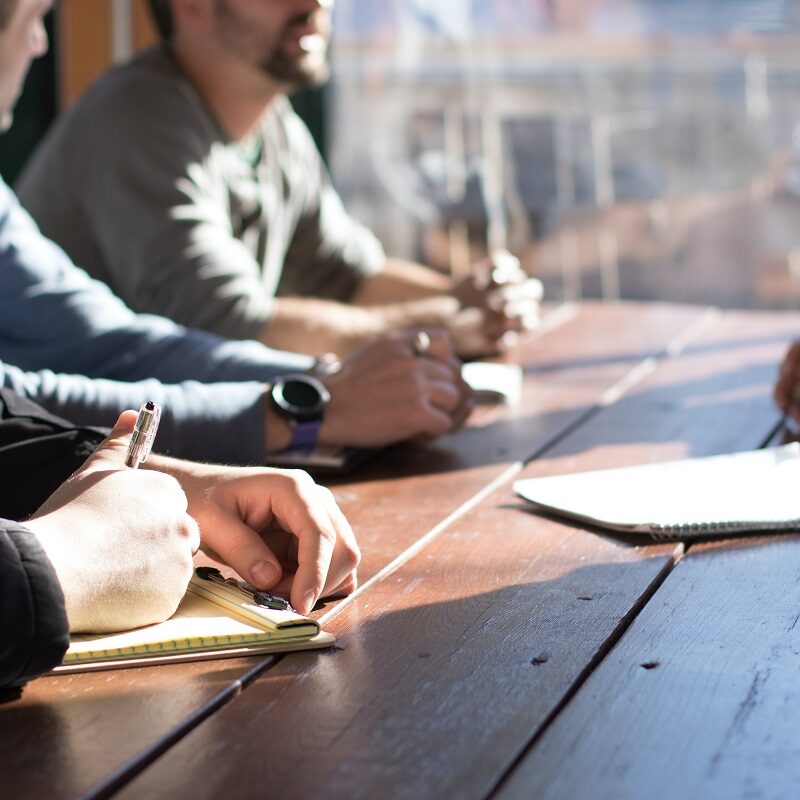 A group of people jotting down notes