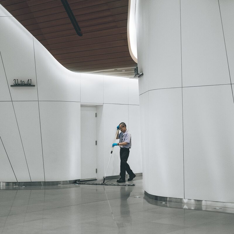 A man cleaning a floor